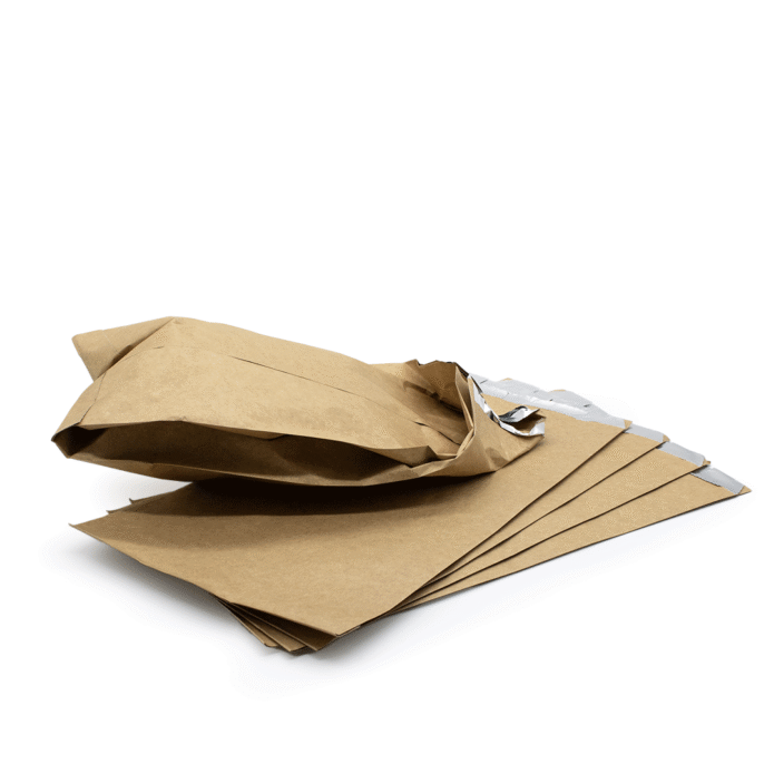 a small stack of brown bags, lined with aluminum foil