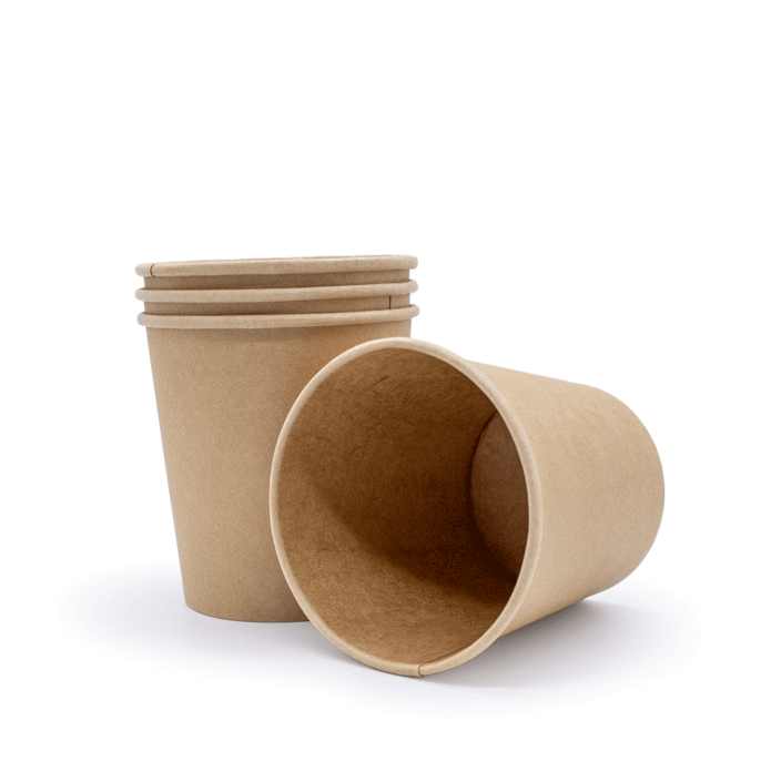brown paper cups , one cup is laying on its side next the to the rest